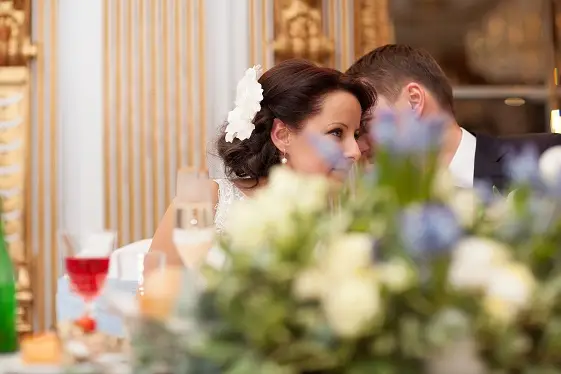 Bride and groom sharing a special moment at the wedding leaning with their heads close together before their wedding dance