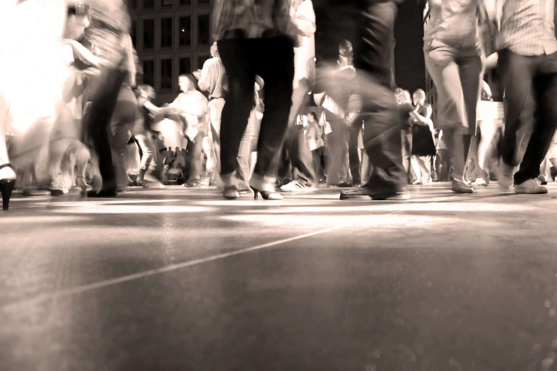 wedding dance floor with guests dancing to wedding theme songs
