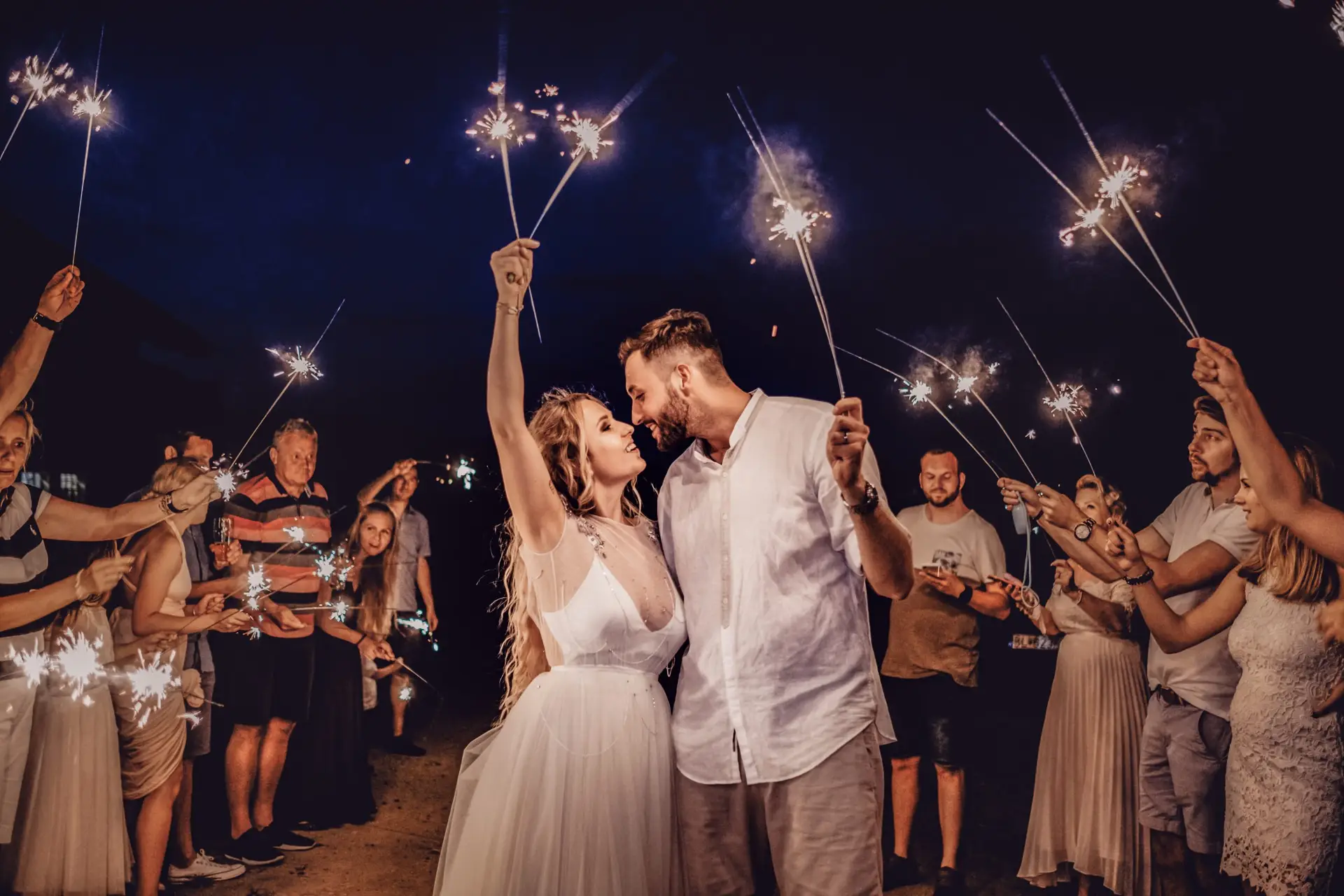 couple at wedding with guests and DIY wedding music or DJ